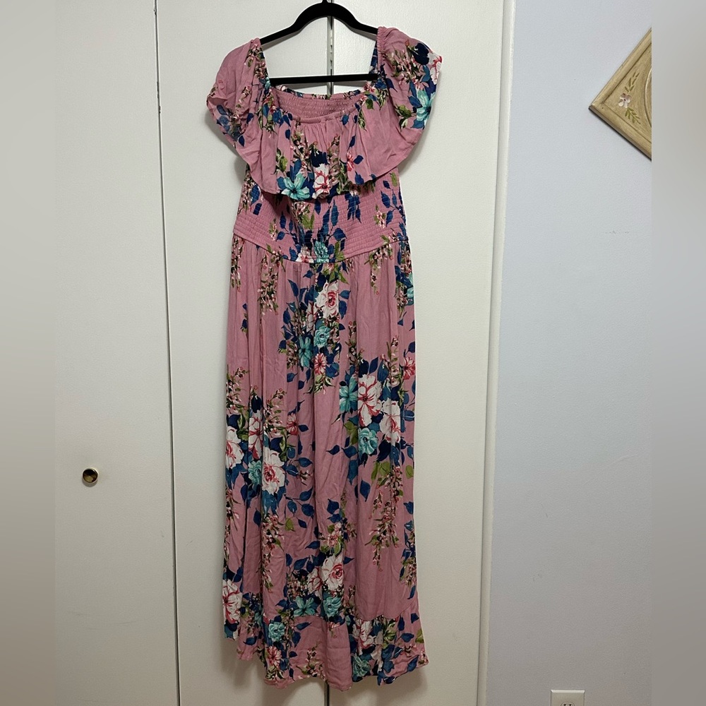 Floral high low dress can be worn off the shoulder or not.